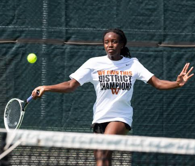 Kinaa Graham 23 attacks the tennis ball. Graham goes on to win first for girls singles. Photo courtesy of Coach Dalrymple.