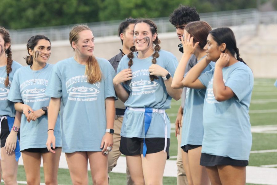 Seniors Rachel Iyer, Lydia Harris, Elizabeth Joyner, Abby Sandlin, and Sneha Bhale converse on the sidelines before the start of the next play. The blue team made a comeback during the last two quarters of the game and wowed everyone with their great effort.