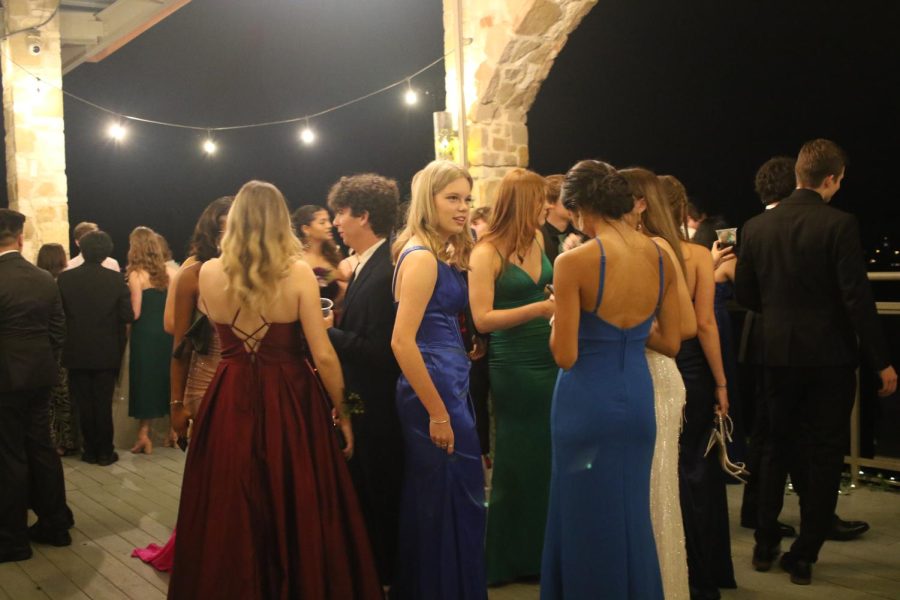 Students gather on the balcony overseeing Lake Travis before heading to the dance floor. The Oasis provided many views for students to remember the night by. 