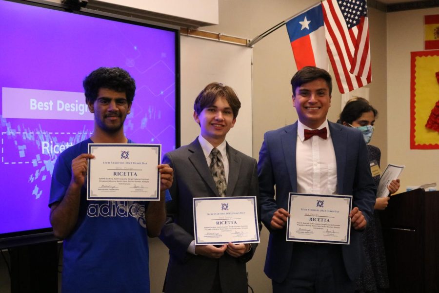 Standing tall, Ricetta builders Justin Lopato, Saketh Sudina, and Jorge Cazares Guzman smile after winning their Best Design award.