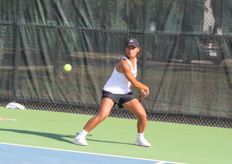 Pursuing the ball, Zoe Chen 25 scrambles to hit a backhand. Chen had a long rally and managed to win the point.