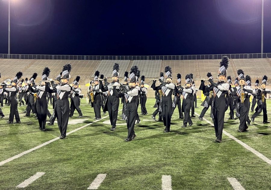 Marching in time, band members maintain strong posture. The band performed last to a large audience at the Festival of Bands.