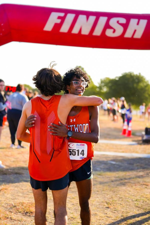 Ganesh Kumarappan ‘23 and Korban Murphy ‘24 celebrate their success after the race. The boys finished in 23rd and 10th place respectively and will be competing at the regional meet. 