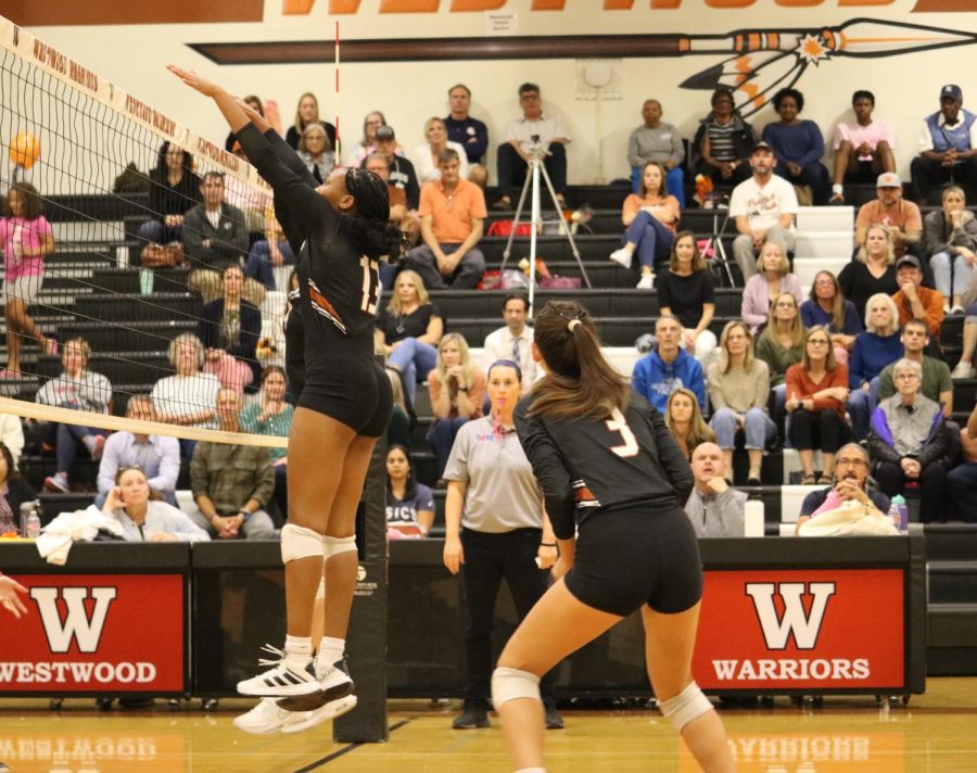 Hardly giving Manor a chance, Middle Blocker Trinity Woods 23 jumps up and defensively rejects Manors attack. Both Woods and Shepherd played intense defense as the night progressed
