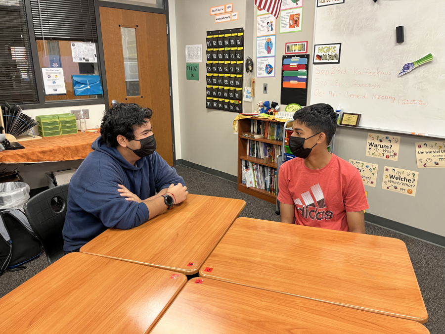 Arjun Bhardwaj 25 and Aarvin Hirode 25 engage in a German conversation based on the discussion questions provided by the officers. Both students are new NGHS members but have experience with learning and using the language. 