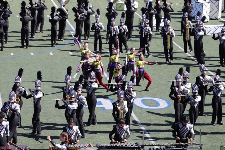Moving+into+formation%2C+the+band+performs+their+show%2C+Beyond+the+Brick%2C+at+UIL+Area.+They+placed+sixth+overall+in+finals+at+the+competion.