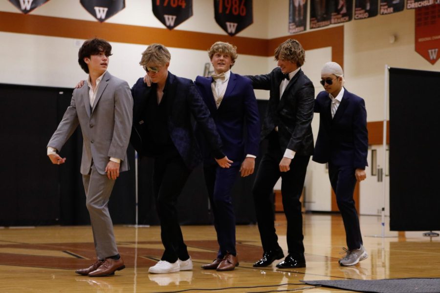 Dancing, seniors Allen Garcia, Henry Stenson, Luke Hagen, Tate Shores, and Wesley Yeung perform a choreographed dance routine to Lip Gloss 
 by Lil Mama. The dance was choreographed by Sundancer Line Officers Carly Kienitz ‘23, Faye Merritt ‘23, and Hannah Bresser ‘24.