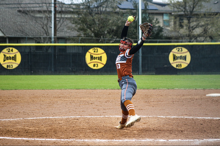 Pitcher Dorothy Ziebell 24 launches the ball towards the batter with a powerful throw.