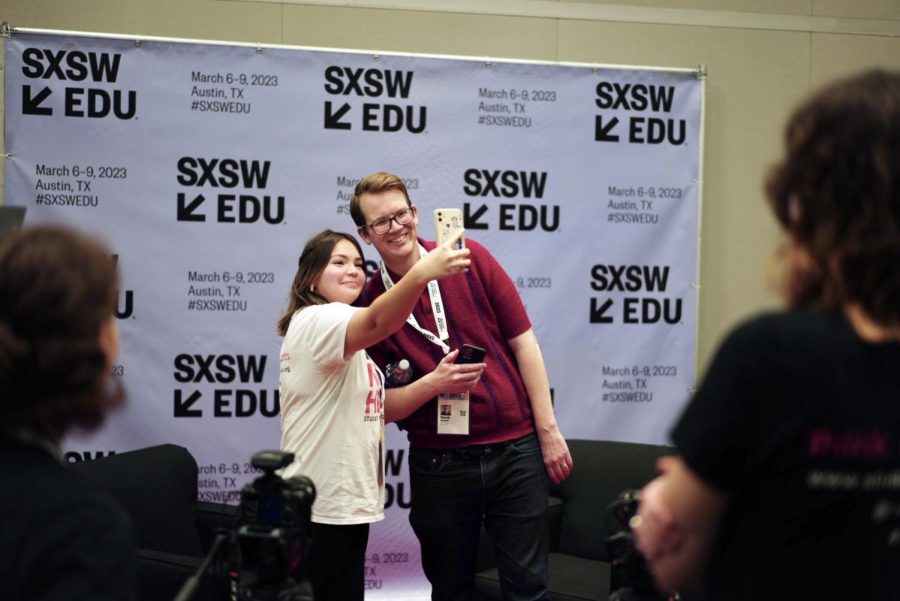 Posing for a selfie, Ivy Beltran 23 meets youtube educator Hank Green. Beltran has watched Greens videos since middle school. Seeing the truly awesome and funny, generous, kind person he is, it was outstanding, breathtaking, and I couldn’t talk or move at the same time, Beltran said.