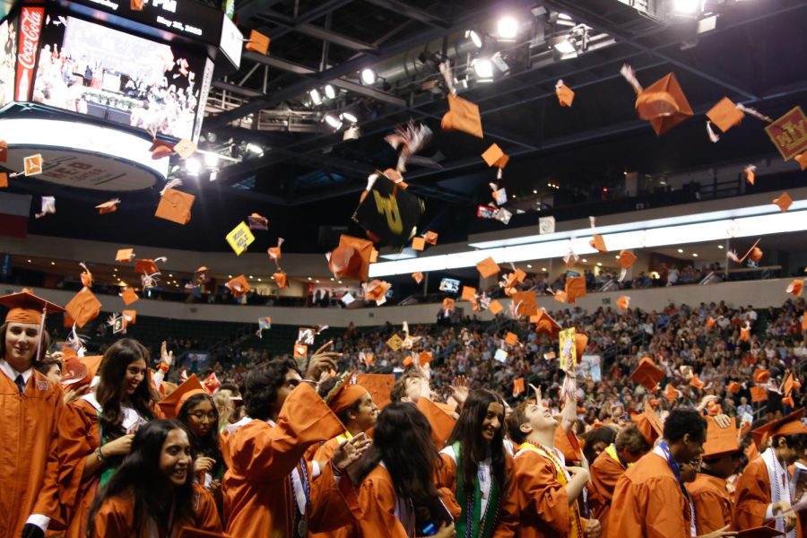 The Class of 2023 tosses their caps into the air after being declared graduates.