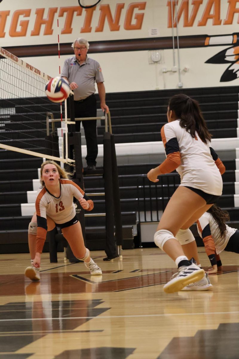 Nathalie Kiefer 26 lowers to the ground to set up a potential kill. The Warriors strong offensive start to the season boosted their confidence coming into the game.