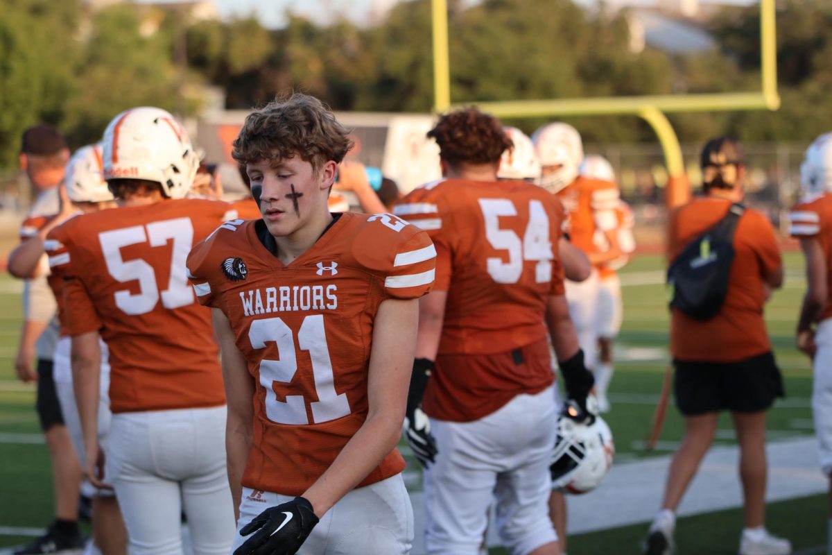 Cole Goehring 26 walks along the sidelines during a transitional period on his way to the bench. The Warrior defense spent most of the time on the field as the offense struggled to find points.  