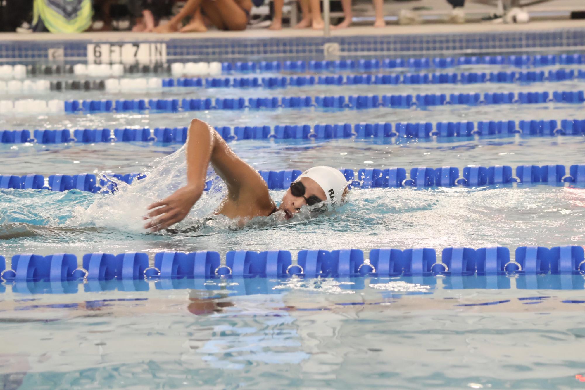 Taking a much-needed breath, Esha Ramanathan 27 reaches for another stroke. As per tradition, each new swimmer to the team swam the 500 yard freestyle at the Orange versus Black meet. 