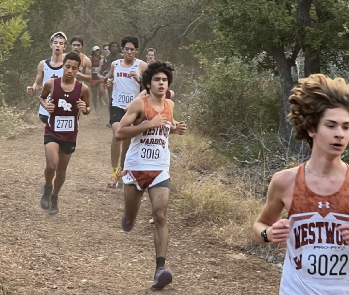 Storming through the course, the Westwood cross country team competes in their first meet of the season at Vista Ridge. The Warriors looked to start off their season strong with a good performance all around. 