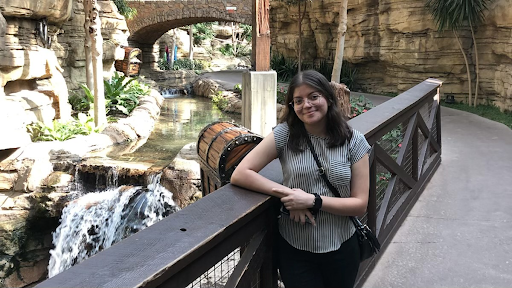 Posing for a photo, math and robotics teacher Ms. Cindy Rodriguez smiles. Entering her first year teaching in her own classroom, Ms. Rodriguez is excited to share her passion for math with students and fulfill her dream of becoming a teacher.