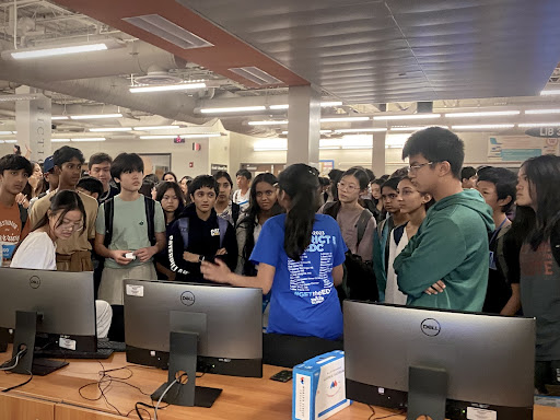 Full of curiosity, new DECA members eagerly listen to the Business Operations Research Project presentation.