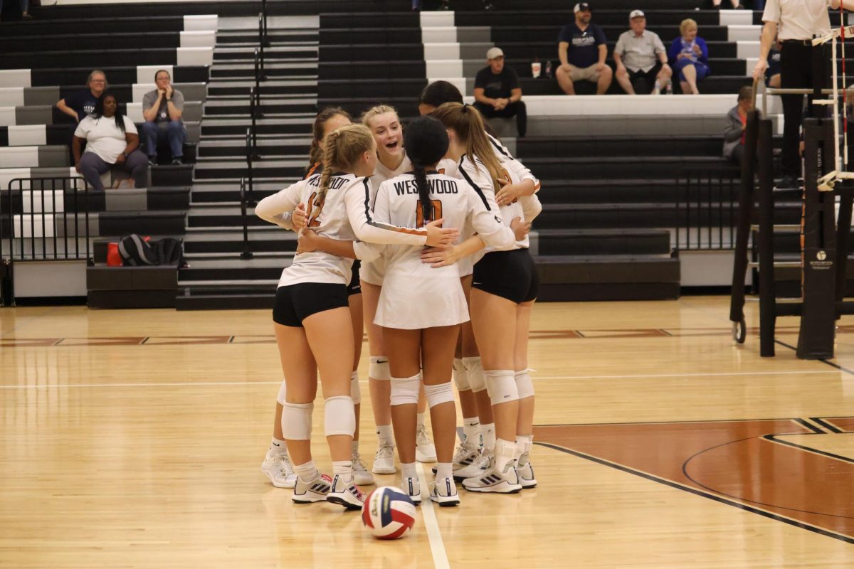 With pride and enthusiasm the Lady Warriors huddle up and celebrate their point versus McNeil. The Lady Warrior offense remained strong and finished off the Mavericks a few points later.