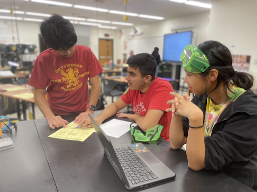 Debating, Ronit Singh ‘26, Hannah Au ‘26, and Jatin Aggarwal ‘26 discuss which chemical reaction will occur. “I was debating with my peers on where the elements on the activity series were and which one will react,” Singh said. “If the first metal in the reactants has higher activity than the second metal, a chemical reaction will occur.”
