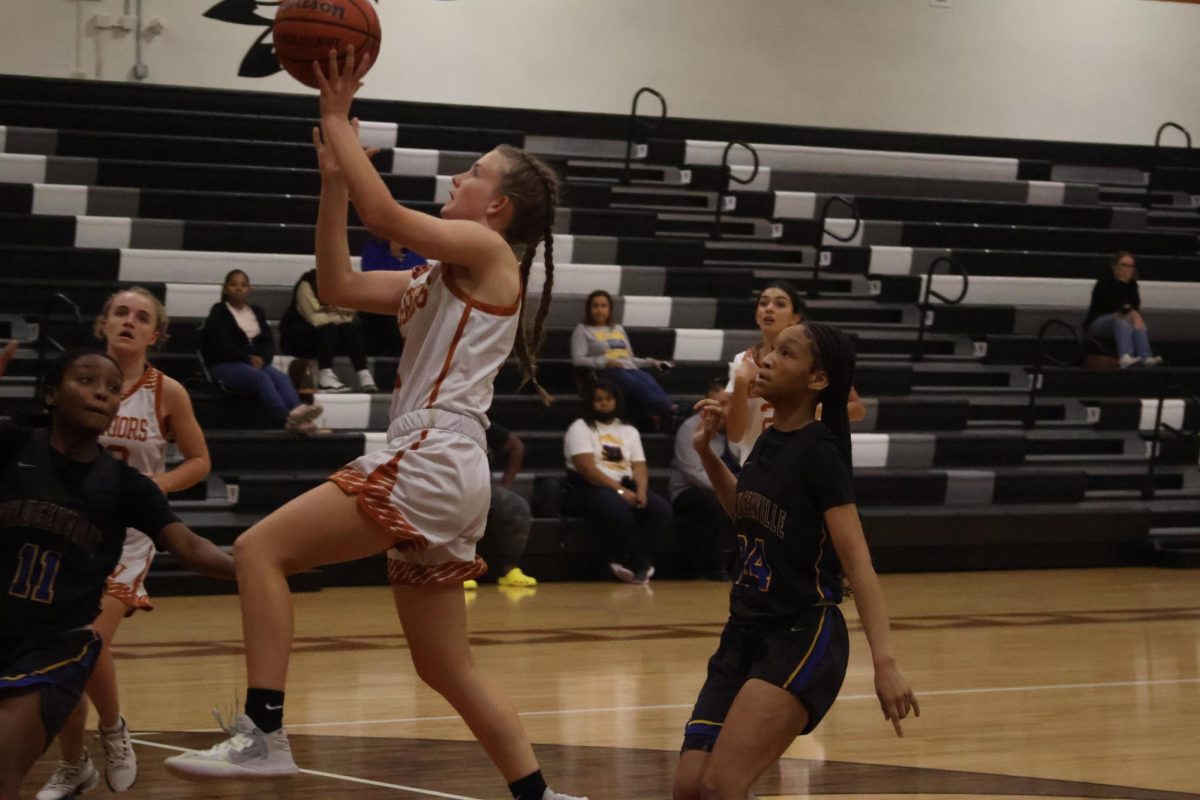 Taking the wide open layup Abby thailing 26 jumps up with no defenders in front of her. The Lady Warriors have worked on upcourt passes and good offensive looks this season. 