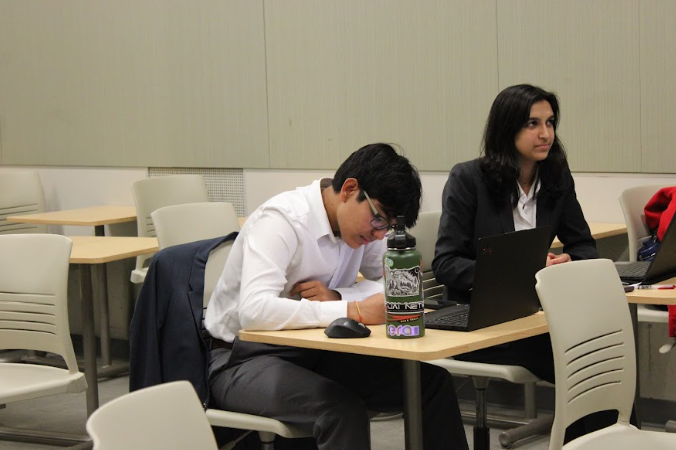 Focused, Shrey Birmiwal 25 prepares for his event at the Longhorn Classic debate tournament. Birmiwal and his partner Siyona Jain 25 worked diligently to in hopes of garnering a victory in their event. 