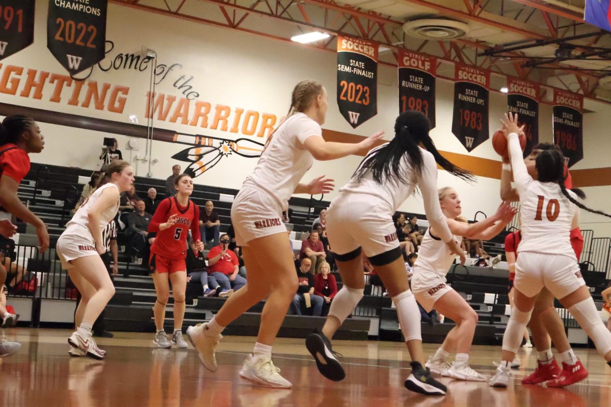 Multiple Westwood Girls block a Vista Ridge player. Westwoods defense slacked off the entire game, but at certain points it improved. Im proud of us for playing hard and keep[ing] going even when times get rough, Caroline Doughtery 25 said.