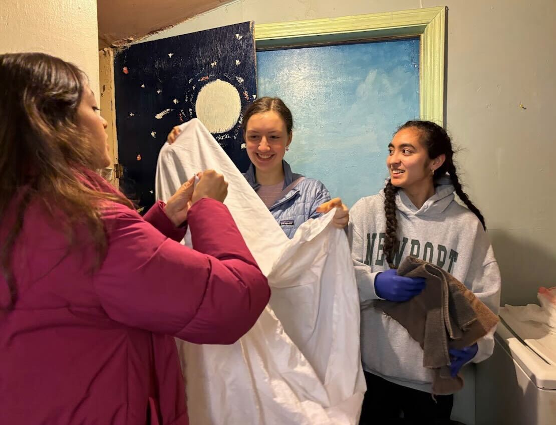 Smiling%2C+Lena+Boas+25+and+Valentina+Galeana+Ruiz+24+fold+a+fitted+sheet+while+Isabella+DAlessandro+25+folds+a+towel.+At+Casa+Marianella%2C+volunteers+were+tasked+with+organizing+a+linen+closet.+Being+able+to+work+with+others+in+my+specified+group+helped+me+more+productive%2C+Galeana+Ruiz+said.+