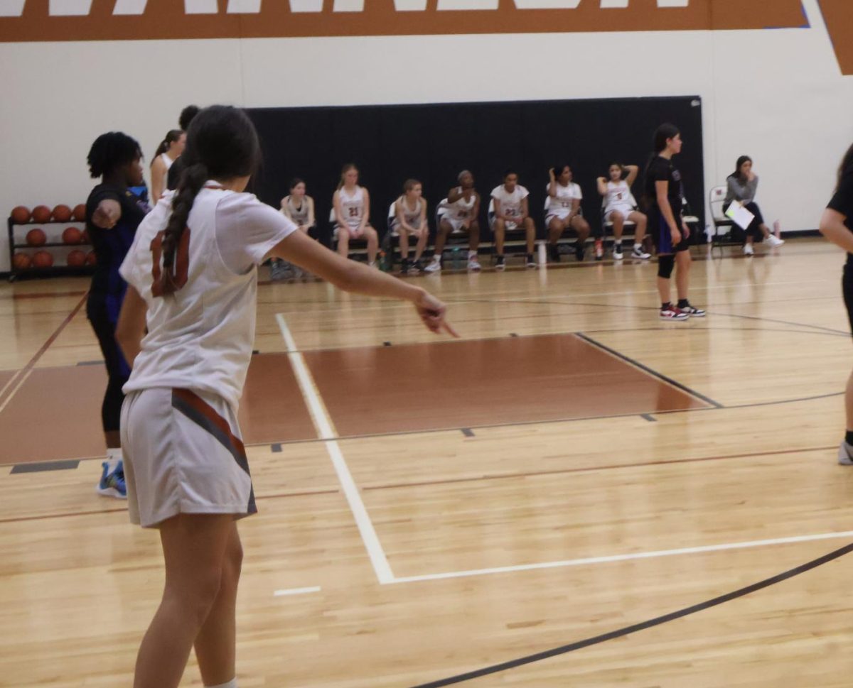 Commanding the floor, Olivia Ochoa ‘27 sets up her teammates and prepares for the last quarter the begin. The Lady Warriors faltered on defense in the final quarter of the game, giving up more points than any other quarter.