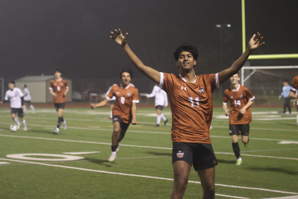 Romir Jain ‘24 runs toward the crowd as they erupt in cheers after he scores the first point of the game. 25 minutes into the game, there hadn’t been any goals scored, but in a quick play Jain was able to best the Raiders. “The highlight of the game for me was probably celebrating with my teammates,” Jain said.
