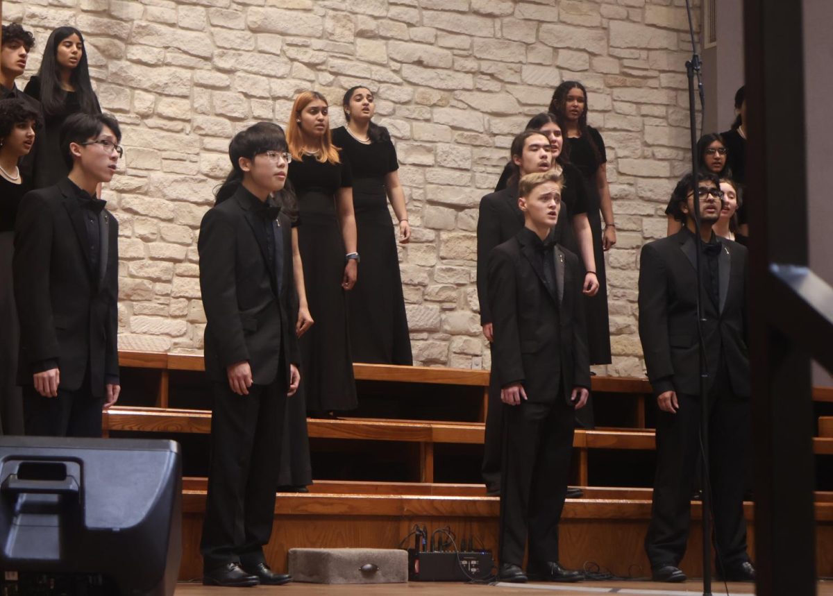 On the Hope Presbyterian Church stands, Chamber members Howell Wu 26, Minsung Kim 25, and Calen Virr 24 perform part of their UIL program. Their spring concert allowed the singers a chance to perform their competition songs ahead of the Madrigal Festival (MadFest) and the UIL competition in March.