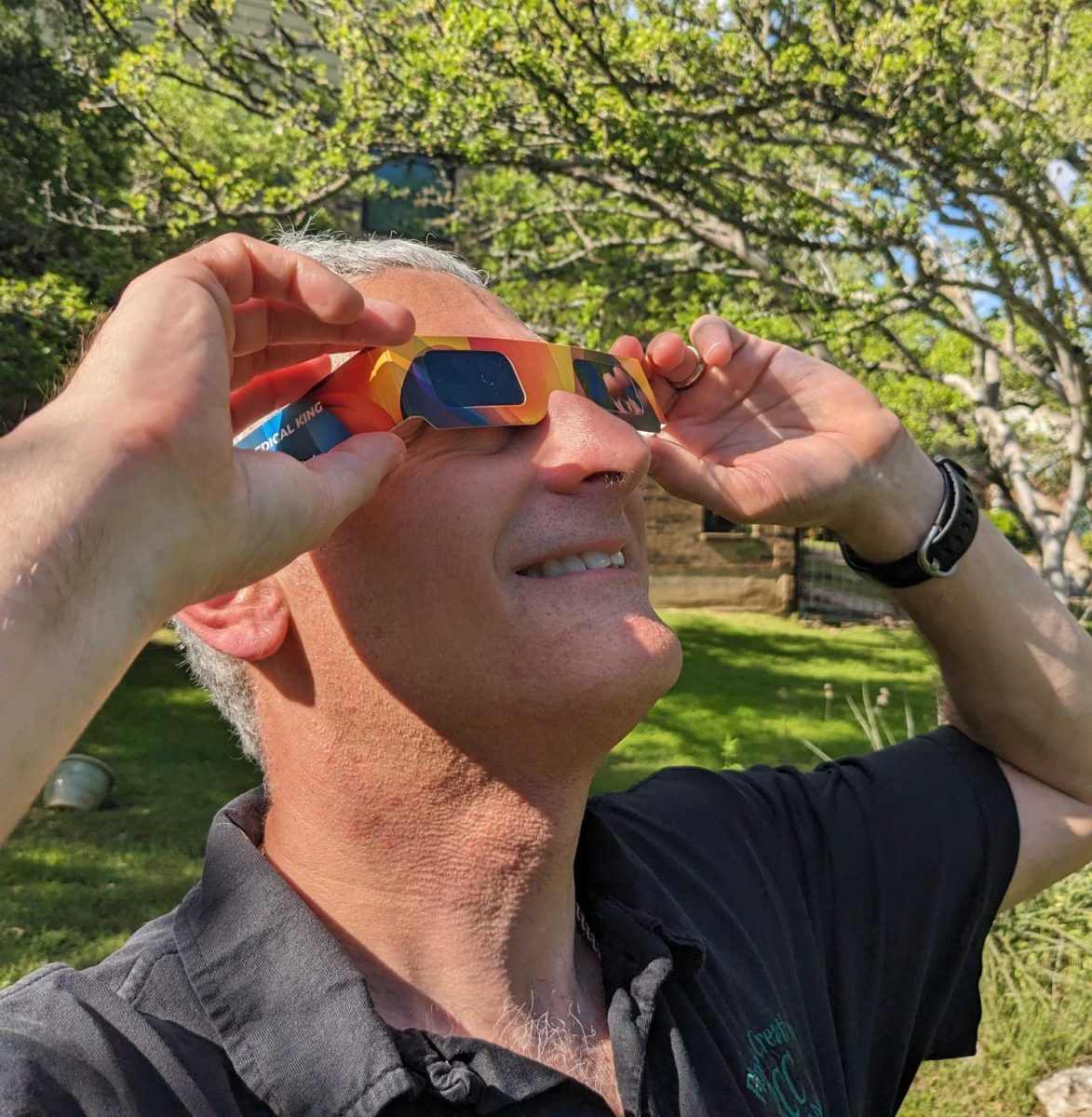 In+preparation+for+the+upcoming+total+solar+eclipse%2C+Austin+resident+Erik+Schlanger+practices+using+solar+eclipse+glasses.+Those+planning+to+observe+the+total+eclipse+have+been+encouraged+to+use+these+special+shaded+lenses+to+protect+their+eyesight+from+the+suns+harsh+rays.