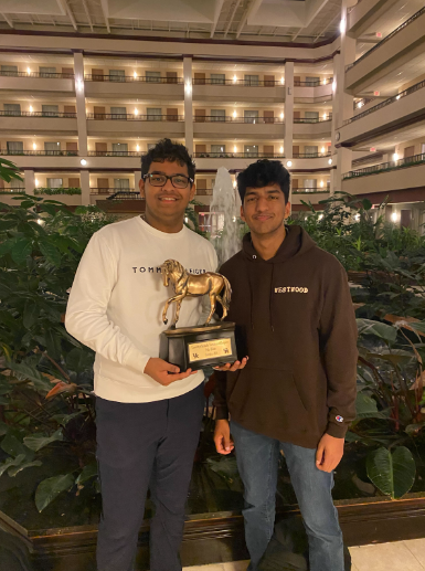 Seniors Ishan Sharma and Ayush Tripathi hold the golden Tournament of Champions trophy after defeating Montgomery Bell Academy students and winning finals on a 2-1 decision. Sharma and Tripathi competed at the University of Kentucky for three days with a total of 11 rounds and only one loss. “It means everything to win the TOC and its a testament to the sacrifices and the time we have put in for the past four years,” Tripathi said.