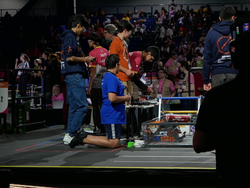 Focused, Jatin Aggarwal ‘26, Abraham Lira ‘24, and Akaash Reddy ‘25 perform last minute checks on Tomahawk’s robot and its programs before the start of a match. The team participated in ten qualification matches before entering the elimination rounds, winning 7 and losing 3.