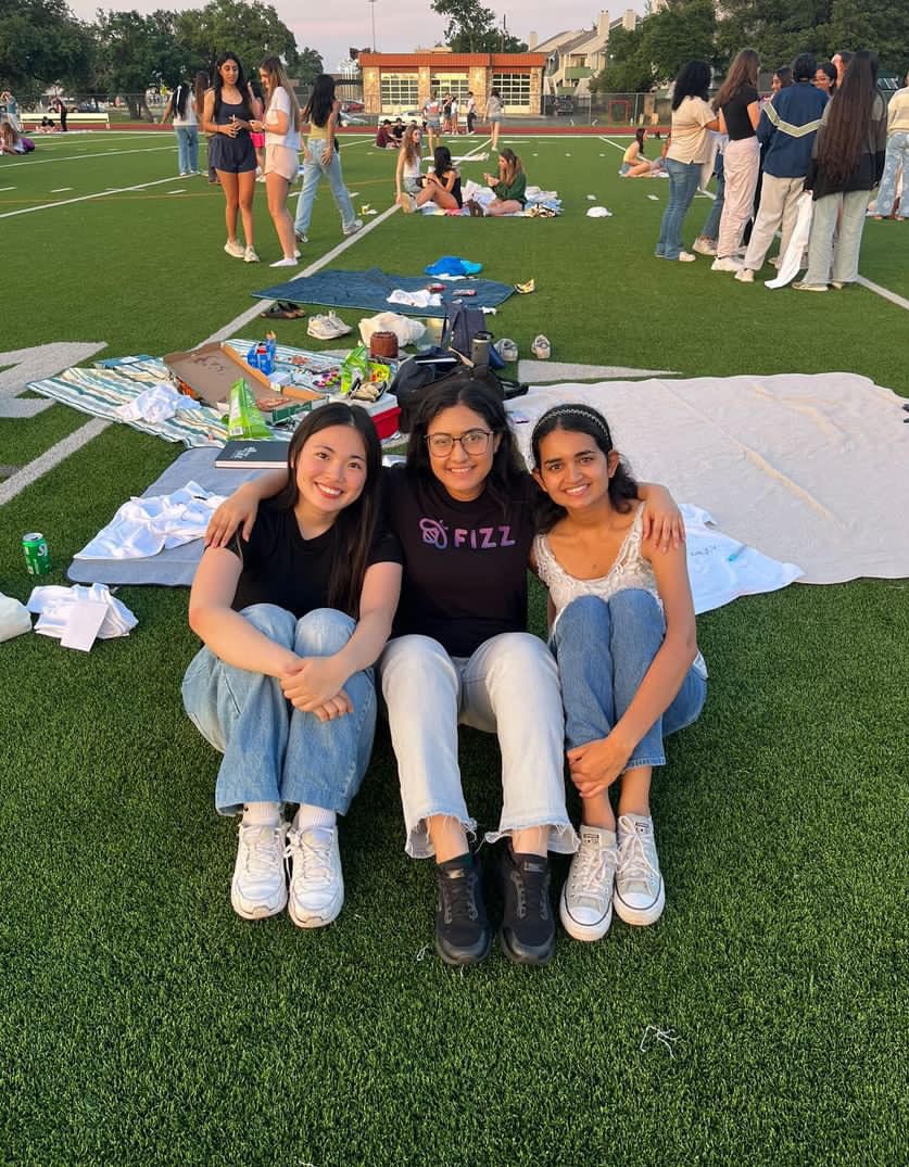 Smiling, seniors Miyuu Tani, Disha Nistala, and Ayushi Merchant pose for a picture. 
The three girls were able to celebrate graduation and their years of friendship through Senior Sunset. 