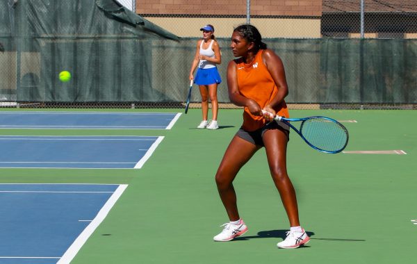 Janya Tellabati ‘26 prepares to hit the ball backhand. She won both her single and doubles matches. “Personally I think I could calm down a little bit during matches,” Tallabati said.

