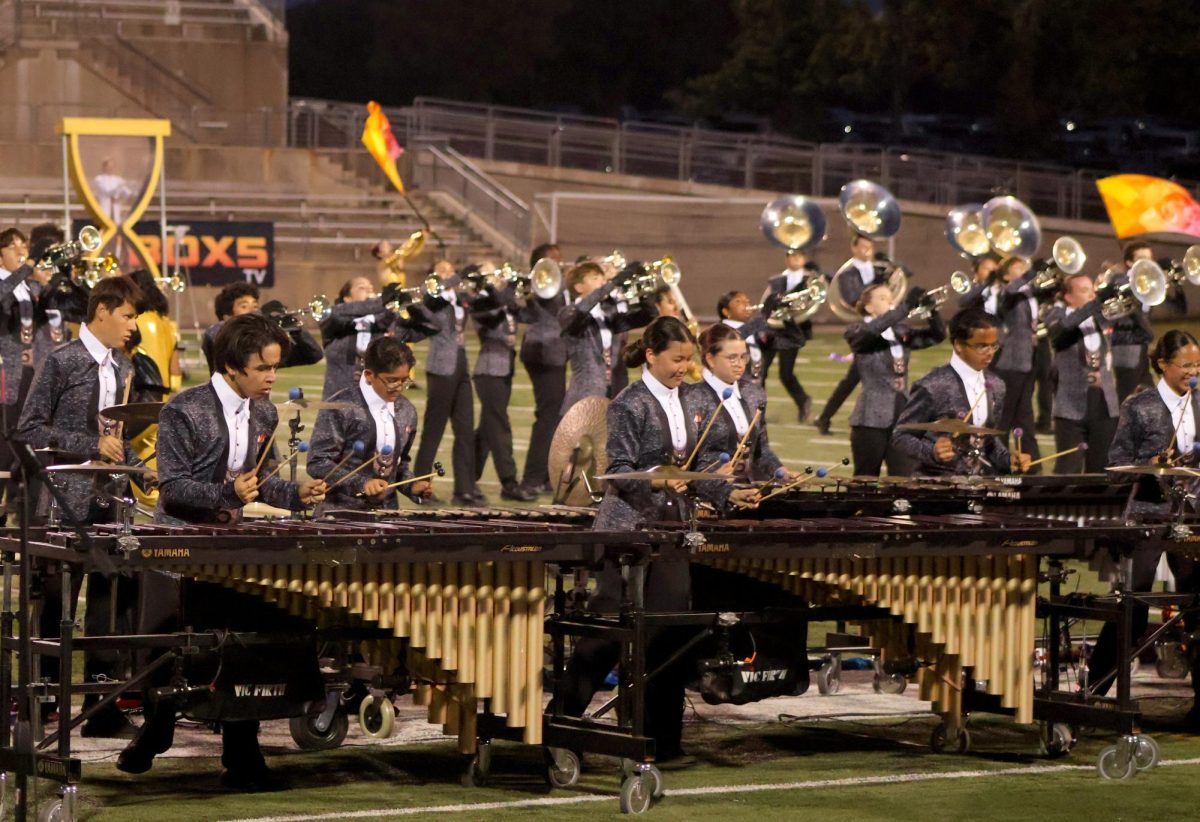 Playing his heart out, Michael Kyriazis '26 concentrates on his performance. The band performed their show Timeless at BOA Austin on Saturday Sept. 21. "I liked the clarity of [the performance], we played together as an ensemble," Kyriazis said. 