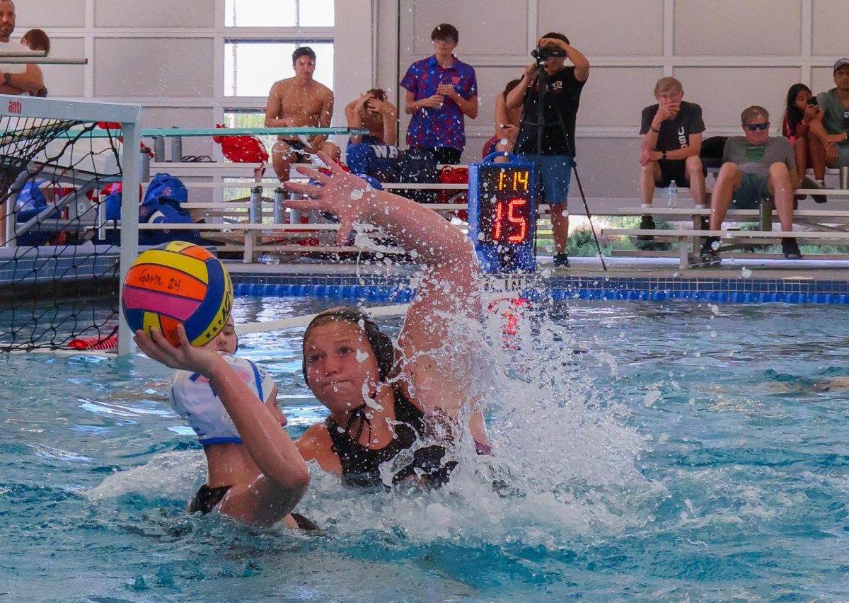 Arms raised, Katherine Mayer '25 attempts to steal the ball from the opposing team. Mayer's strong defensive skills would go on to solidify her team's victory. 