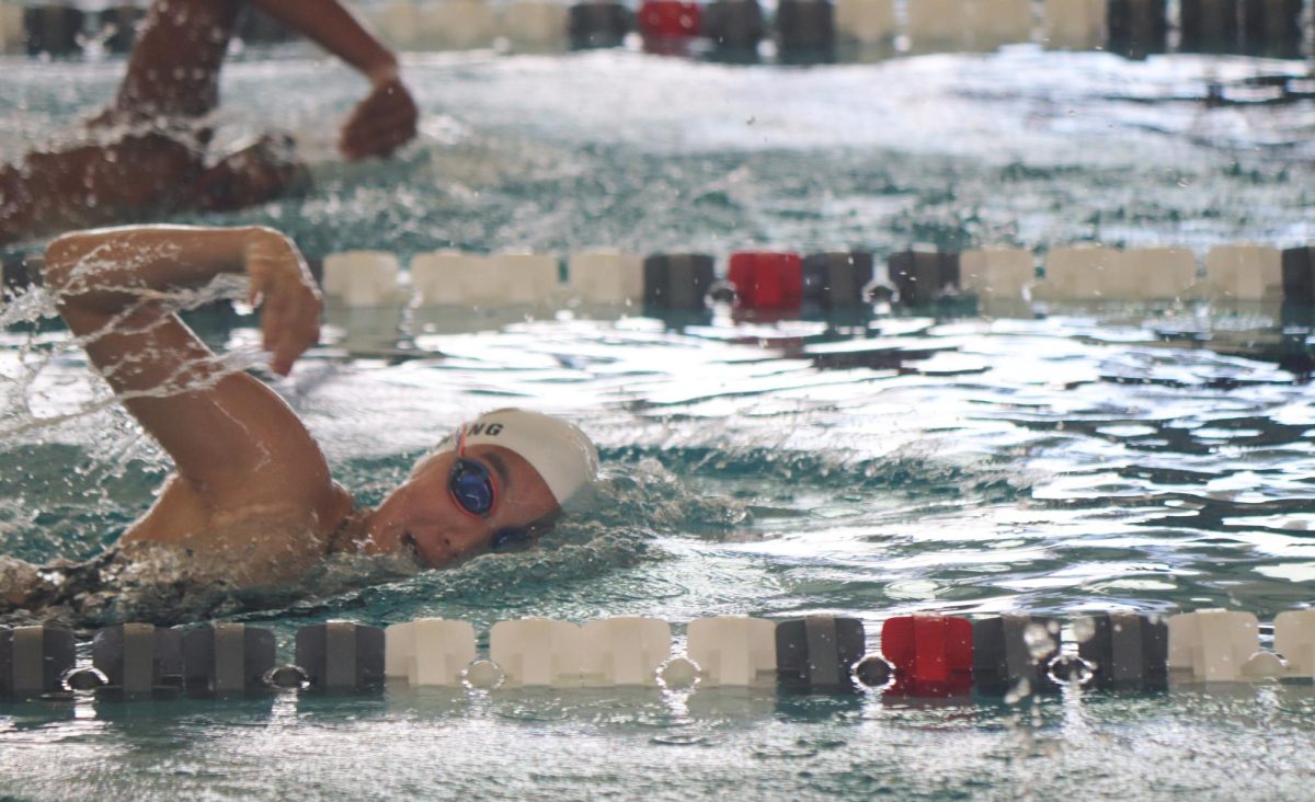 In a thrilling display of endurance, Alice Zhang '28 goes stroke for stroke with her McNeil competitor  in the 500 yard freestyle. The two swimmers, mere inches apart, push through as they near the finish line. "“It was so challenging physically and mentally,” Zhang said. “You have to do all the strokes and it’s very tiring but you just have to push through for your teammates.”