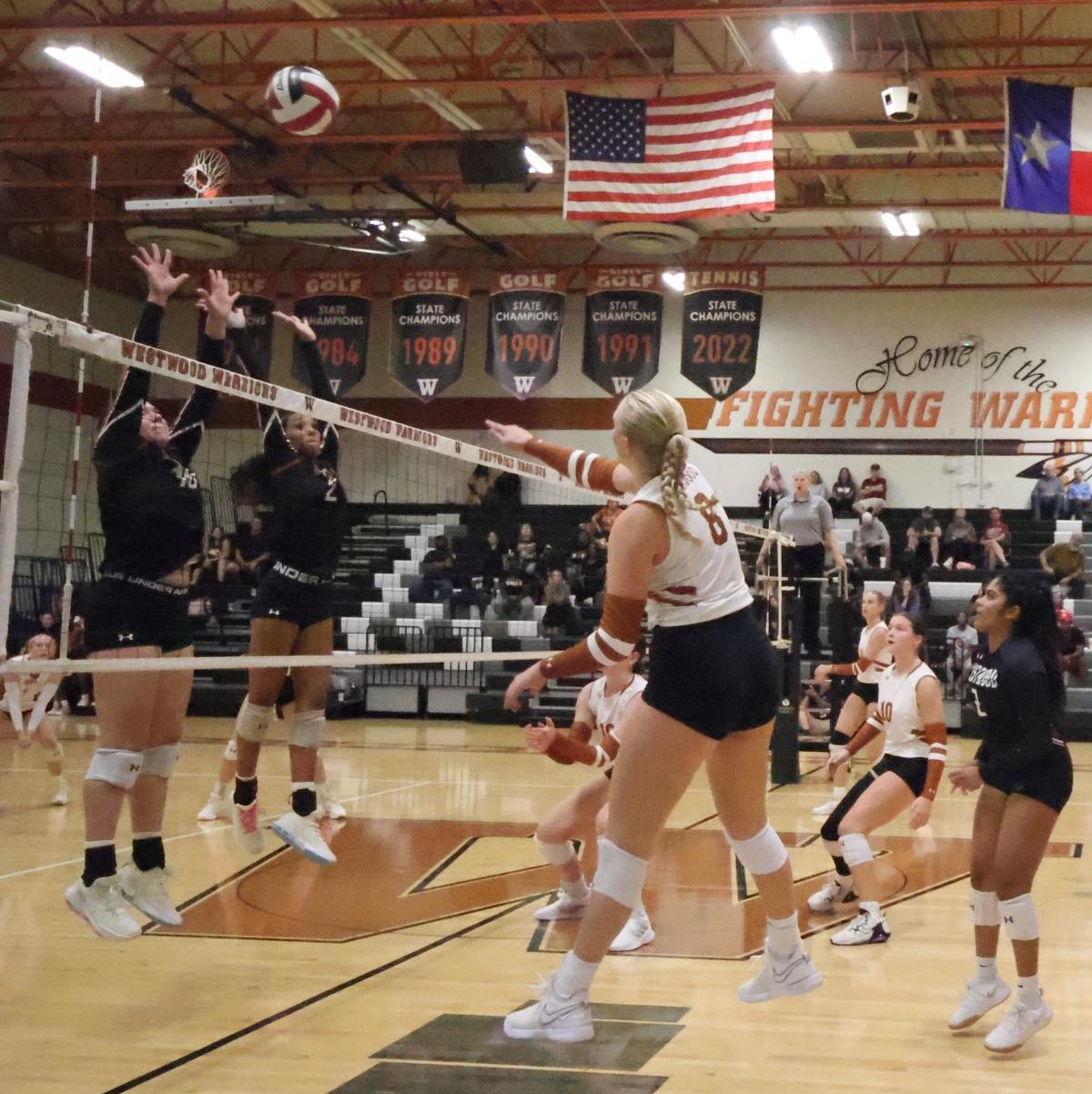 Leaping up, Harper Zoll '25 hits a powerful block to the Hutto Hippos during the first set on Sept. 3. As outside and opposite hitter, Zoll contributed greatly to the game by participating in long rallies. "I had number two and number 10 on me, which were the two best players on their team. I was a little nervous, but I knew I had to do what was right for the team," Zoll said.