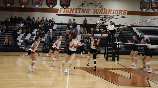 Preparing to spike the ball, Lila Wellington '27 leaps to set the ball for her teammate so that she can get the kill. The Warriors had their first district win against McNeil. "I think [going into this game] we just remembered what we were playing for," Wellington said. "We really needed this win and we went out there wanting to win so we took it."
