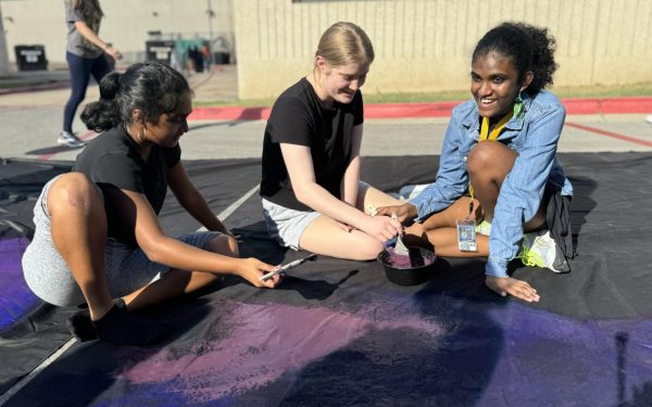 Working together to paint their section of the backdrop, NAHS members Kendall Potts ‘27, Swasthiya Mahesh ‘27, and Ananya Velmurugan ‘27 enjoy the event together. They not only saw this as a chance to contribute something good to their school, but also to socialize and form new connections based on shared passions for art. “When I’m at the dance, I can look up at the finished backdrop and remember that I worked on that and how amazing it was that I was a part of that,” Ananya Velmurugan ‘27 said. 