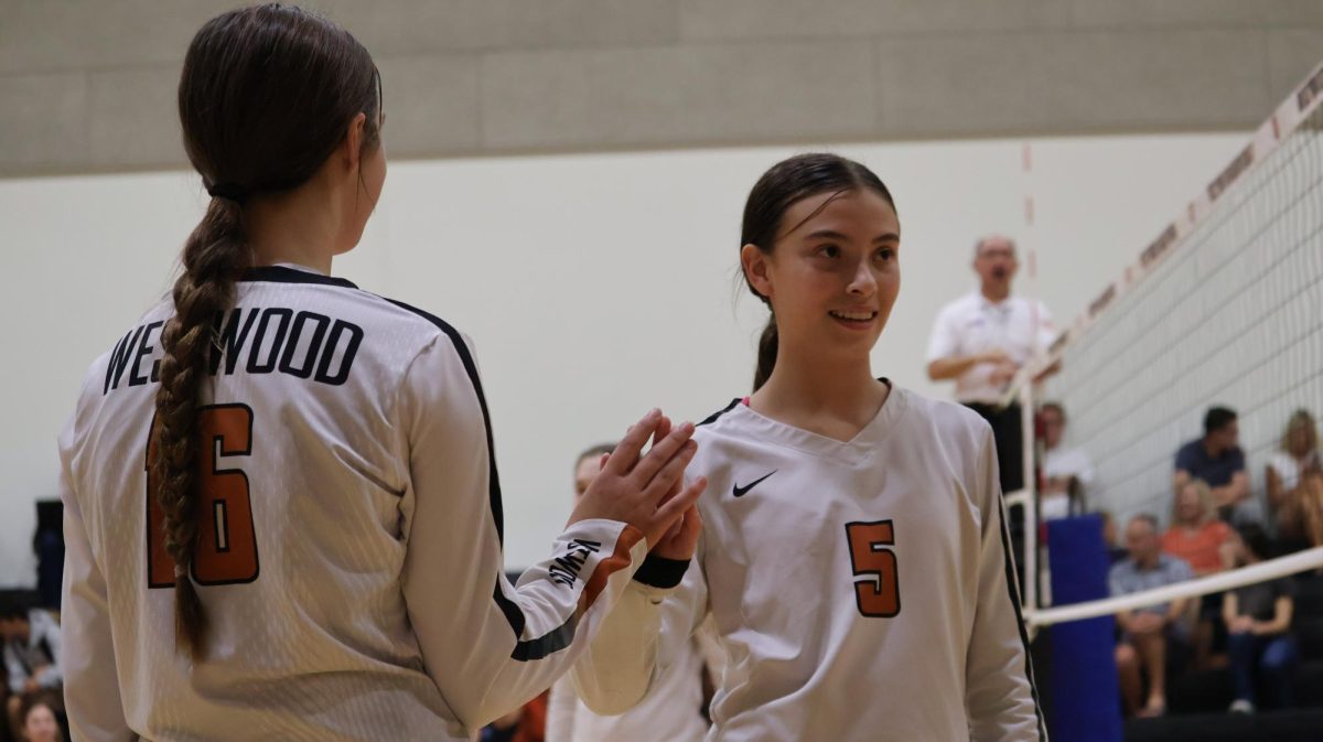 Freshmen Quinn Ewert and Olivia Navarro get ready to sub out. The Warriors were able to play different positions this game and try out new things because they were so ahead. 