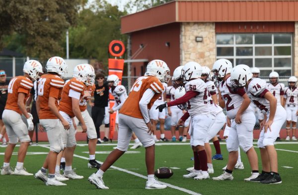 With all eyes on the ball, the Warriors get into their positions and prepare for the snap ready to continue the game. ALthough the Warriors were behind throughout the game they kept up their energy and fought every second they could.