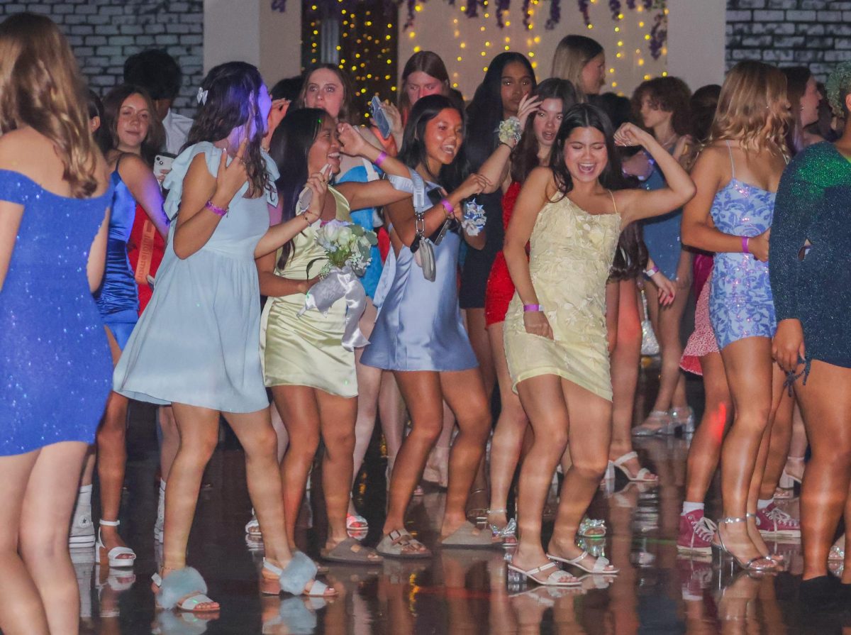 In the middle of the cafeteria, Mimi Echavez '27 dances to a song in a crowd of other students. The DJ was quick to play student-requested music, bringing energy to the dance floor. 