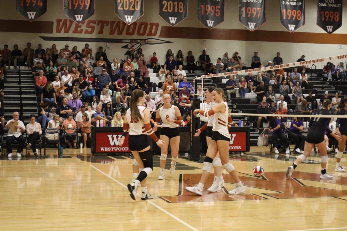 Excitedly huddling together, after getting a kill the Warriors join together and high five each other. After every point, whether they win it or not, the Warriors join together to talk strategy for the next play.  The Warriors played Vista Ridge in their last home game of the 2024 season. 