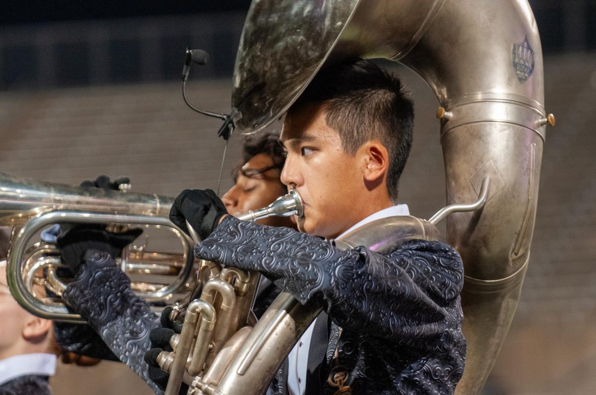 Focused on the drum majors, Jonathan Chien ‘25 performs 'Clair De Lune' as a part of a small ensemble. The Warrior Band performed their show, entitled 'Timeless', at the UIL Region 26 marching contest on Tuesday, Oct. 15.