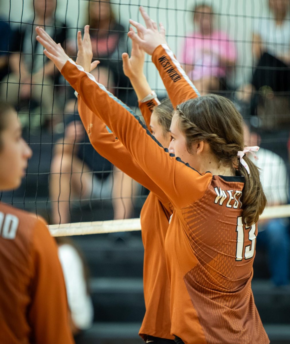 Waiting for the Rangers to serve, Lucy Aldrete '28 gets ready to block the incoming serve. During the course of this match, blockers were essential to the Warrior's game, helping save easy points as well as even scoring by blocking.