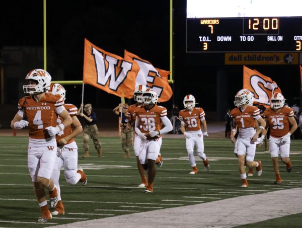 Running back to the field after halftime, Drew Norrell '24 prepares for the second half of the game after leading the team in yards in the first half. Fighting through major setbacks throughout the season, the Warriors ended it all 2-8 after a powerful win over Vista Ridge. "Every week we trained for war, this year we definitely had to fight to win." Coach Dezmun Williams said. 