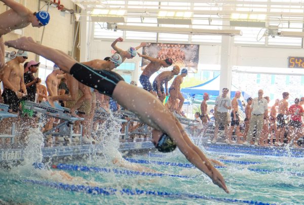 After shaking off early fatigue, Phoenix Mielcarek '25 prepares to dive in for the victorious 200-yard freestyle relay. "I’m racing pretty well today," Mielcarek said. "I just swam my most fun event which was the 200 [yard] freestyle relay, we won that so I feel super proud and that was really cool."