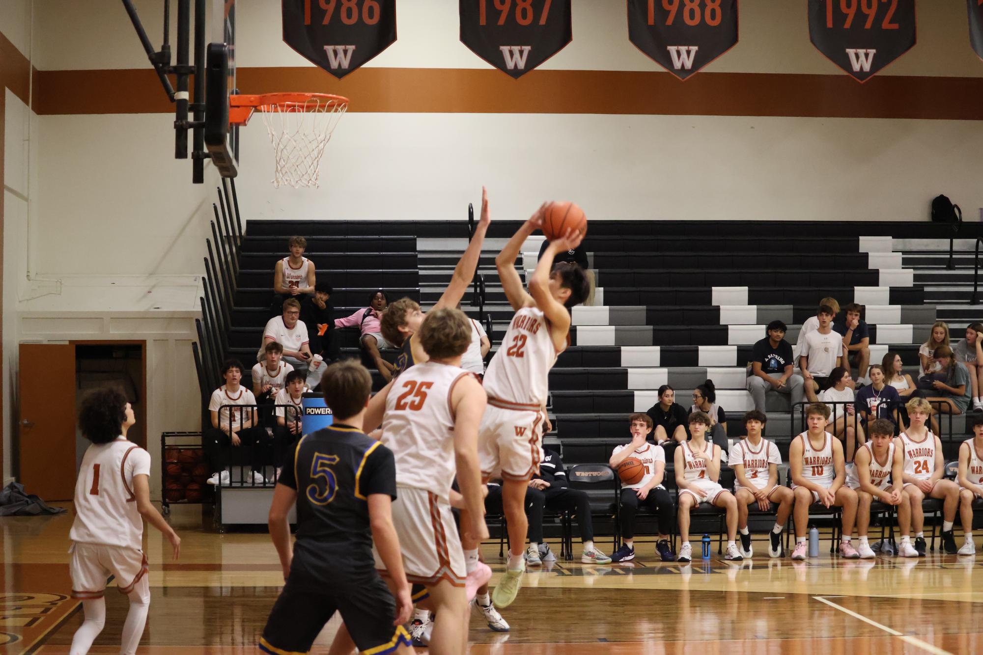 Aiming High, Marshall Sjariffudin ‘27  is suspended in mid air, while he makes a jump shot. The key to his success is to make sure he’s mentally and physically prepared. “I made sure to be really dialed in right after the final bell rang,” Sjariffudin said