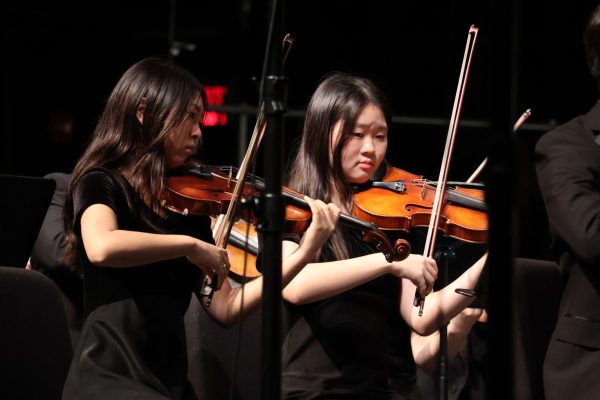 Delving into Mozart's "Divertimento in F Major", violinists Haruna Kubo '26 and Jianna Chun '26 express their skill and technique while moving with the orchestra. "Divertimento" was the opening piece of the evening, bringing an elegant and sophisticated mood for the audience to enjoy. 